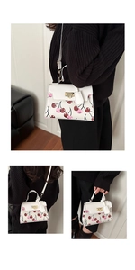 Three-way view of white cherry print tote bag showing handbag, shoulder, and crossbody styles