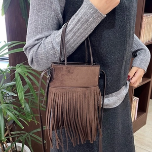 Brown vintage suede handbag with ethnic fringe details and long shoulder strap