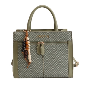 Gray-green patchwork handbag in vegan leather and herringbone fabric with wooden beads