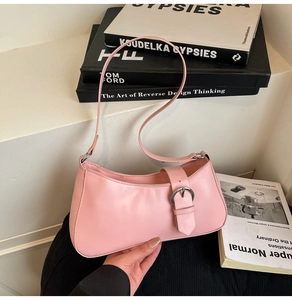 Pink French baguette underarm bag with silver metal buckle and sleek PU leather texture