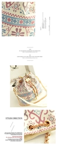 Detailed close-up of ethnic print canvas bucket bag with pearl drawstring and gold chain strap