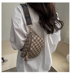 Detail of vintage plaid waist bag with geometric wide strap shown on model's back
