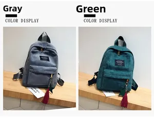 Detail of gray and green corduroy backpacks with woven labels and star pendants