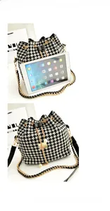 Detail of houndstooth bucket bag showing drawstring closure and size relative to a tablet