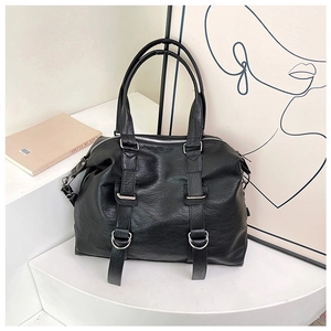 Detailed shot of black vintage shoulder bag with pebble grain leather and silver D-rings