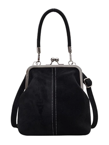 Retro black faux suede kiss-lock handbag with white stitching and top handle