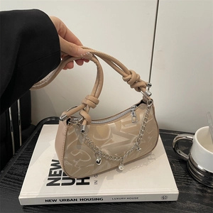 Minimalist beige PU leather underarm bag with knot handle and star chain detail