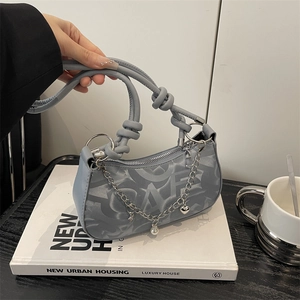 Gray-blue half-moon shoulder bag with monogram print and silver metal charms