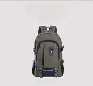 Front view detail of army green canvas backpack with black straps and leather buckle accents