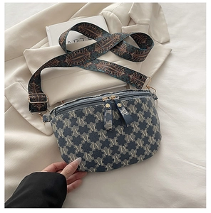 Detailed view of vintage blue monogram bag with ethnic style jacquard shoulder strap
