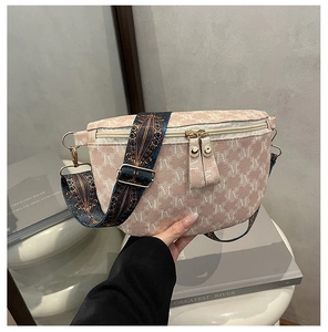 Close-up of retro plaid crossbody bag with 'M' pattern and ethnic style wide strap