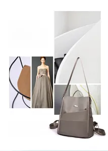 Detail of taupe minimalist oxford cloth backpack with front zipper pocket and side pockets