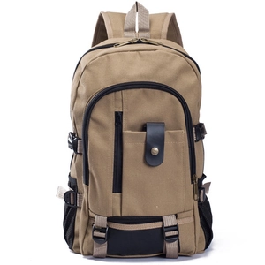 Khaki canvas backpack for travel and casual use with multiple pockets and leather accents