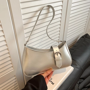 Silver metallic underarm bag with glossy leather and large round metal buckle detail