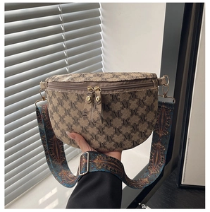 Detail of vintage brown checkerboard waist bag with embroidered geometric wide strap