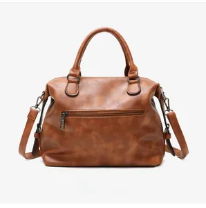 Back view of vintage brown PU leather Boston bag with zipper pocket and shoulder strap