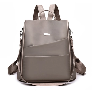 Women's grey nylon backpack with geometric pocket design for casual commute and travel