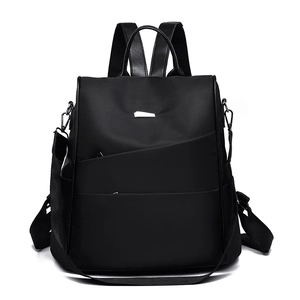 Classic black oxford fabric backpack for women featuring a sleek minimalist design and metal plaque