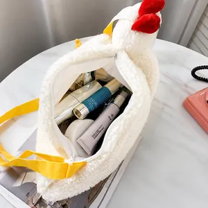 Interior storage space of the plush white chicken bag showing capacity for daily essentials