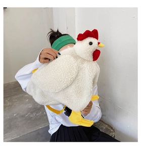 Detail shot of a white plush chicken backpack featuring red comb and yellow soft webbed feet