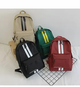 Group display of casual canvas backpacks in khaki, green, black, and burgundy colors