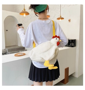Detailed view of the cute white plush chicken crossbody bag with a yellow adjustable strap