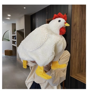 Detail of soft white plush chicken backpack featuring red comb and adjustable straps