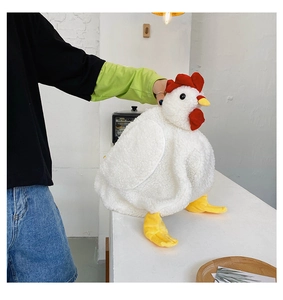 Detailed close-up of white plush chicken bag with red comb and yellow feet features