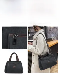 Detail view of large black canvas travel bag featuring durable handles and adjustable strap