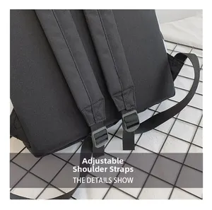 Detail view of adjustable widened shoulder straps with buckles on a black backpack