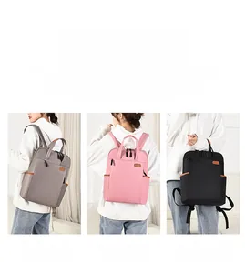 Three-way carry oxford backpack in grey, pink, and black for commuting and travel