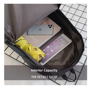 Internal capacity of black backpack showing storage for tablet, books and umbrella