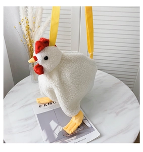 Detail of soft white plush chicken bag with red crest and yellow nylon strap