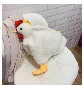 Detail of plush chicken bag showing white faux lamb wool texture and red felt comb