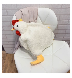 Detail of cute chick plush bag showing white curly fleece texture and red comb accent