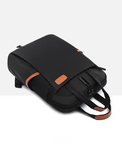 Detail of waterproof oxford laptop backpack with brown leather handles and zipper pockets