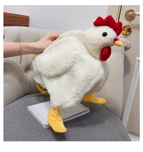 Detail of cute plush chicken backpack with soft white fleece and yellow nylon straps