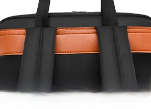 Detail of the reinforced stitching on the black Oxford backpack handle and straps