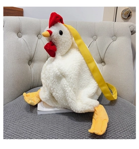 Detail of plush chicken shoulder bag with white sherpa texture and yellow strap