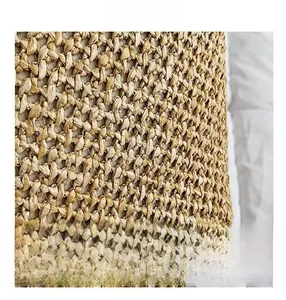 Close-up of tight bi-directional straw weaving texture on a summer beach bag