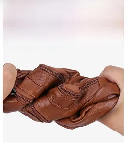 Detail of soft brown leather bag showing high flexibility and scratch-resistant texture