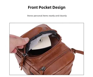 Macro view of functional front pocket on brown pebble leather crossbody bag for essentials