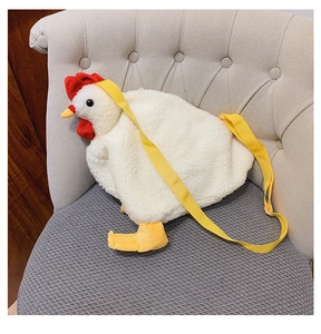 Detailed macro of the plush chicken crossbody bag with fuzzy texture and red comb
