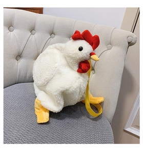 Detail of soft white plush chicken bag featuring a red comb and yellow strap