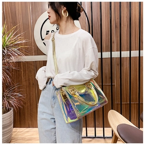 Detailed holographic tote bag showing golden zipper and adjustable shoulder strap style