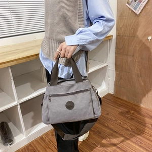 Mens vintage canvas travel duffel bag with large capacity and adjustable shoulder strap