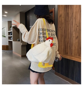 Detail shot of the cute white plush chicken bag showing real-life size and fluffy texture
