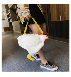 Detail of cute plush chicken crossbody bag showing soft faux lamb wool and yellow strap
