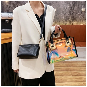 Detailed view of laser holographic tote with black leather crossbody inner bag set