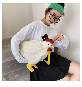 Cute white plush chicken shoulder bag modeled on a girl sitting on concrete stairs